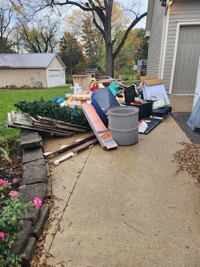 Dumpster being loaded with debris for 30 Yard Dumpster Rental in Steilacoom